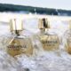 Nateeva fragrances and perfums on a beach with waves